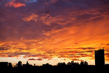 City sunset sky - dramatic view in orange color