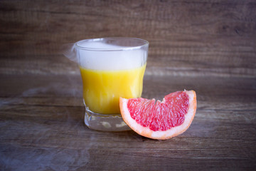 Grapefruit juice, summer cocktail with citrus. Cool cocktail and grapefruit. Refreshing cocktail
