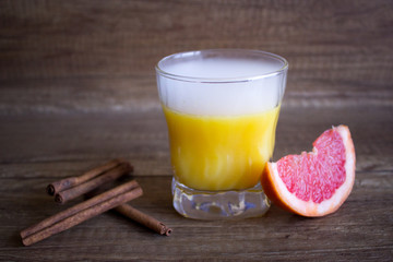 Grapefruit juice, summer cocktail with citrus. Cool cocktail and grapefruit and cinnamon. Refreshing
