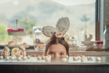  Mother and her cute little daughter playing in children's room while preparing Easter decoration.  - obrazy, fototapety, plakaty