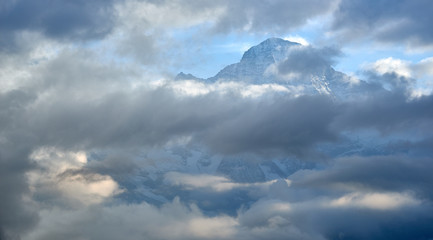 Panoramic view of the mountains in cloudy weather in Lauterbrunnen valley in Switzerland.