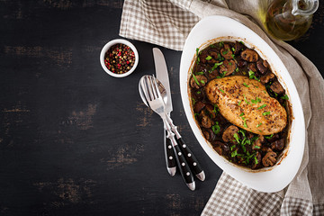 Baked chicken breast with mushrooms in balsamic  sauce  on the table. Top view