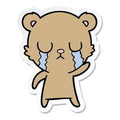 Obraz premium sticker of a crying cartoon bear