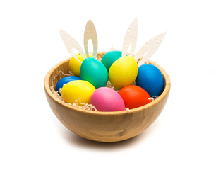 Fototapeta na wymiar easter eggs with bunny ears in bowl isolated
