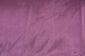 closeup photo of a purple, silky, satin background