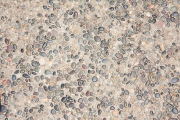 closeup, horizontal photo of a multicolored rock, pebble, textured background