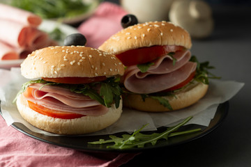 Hamburger with ham. Two burgers, hoemmade food. healthy sandwich with fresh vegetables.