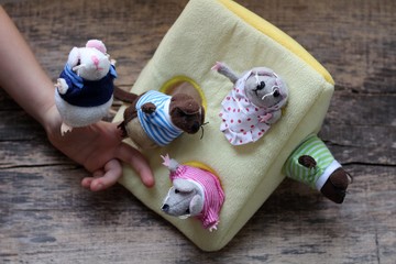 Fingers toys. Funny animals puppets in the fingers. Children's activities concept. Happy theatrical...