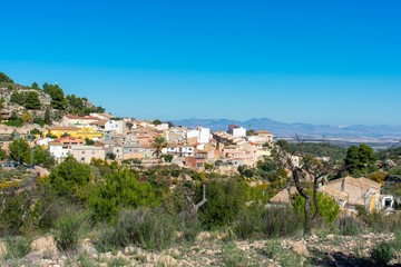 Fototapeta na wymiar A small village nestled in the dry hills of southern Spain