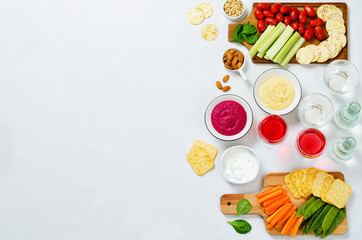 Variation of healthy vegan snacks. Vegetables, crackers, dip and hummus