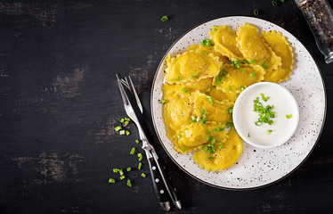 Ravioli with spinach and ricotta cheese. Italian cuisine. Top view