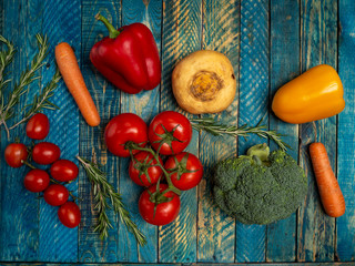 Bright vegetables on wooden background