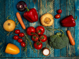 Bright vegetables on wooden background