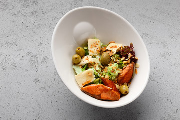 Delisious salad with salmon, lettuce and olives