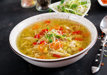 Soup with lentils, carrots, chicken meat, paprika, celery  in a bowl.