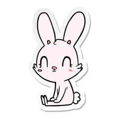Fototapeta na wymiar sticker of a cute cartoon rabbit sitting
