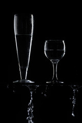 set of transparent glasses on black background 