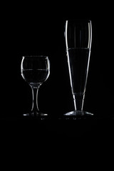 set of transparent glasses on black background 