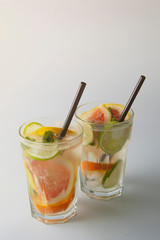 Fresh citrus infused flavored lemonade. Refreshing summer homemade cocktail with lemon, lime, orange and grapefruit.