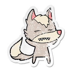 distressed sticker of a cartoon wolf showing teeth