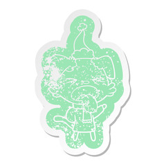 cartoon distressed sticker of a dog wearing scarf and pullover wearing santa hat