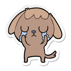 sticker of a cute cartoon dog crying