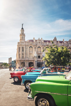 Fototapeta Cuban colorful vintage cars in front of the Gran Teatro - Havana, Cuba