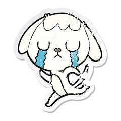 distressed sticker of a cute cartoon dog crying