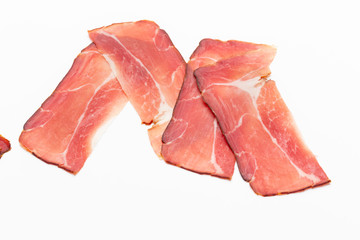 Hamon sliced on white background. Spanisch traditional meat.