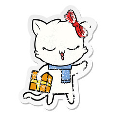 distressed sticker of a cartoon girl cat with christmas present