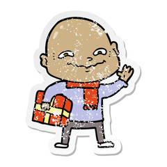 distressed sticker of a cartoon nervous man with xmas present