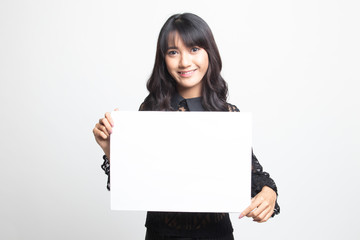 Young Asian woman with white blank sign.