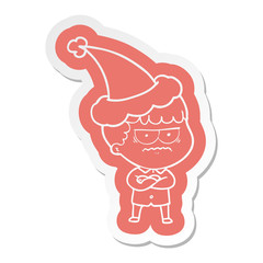 cartoon  sticker of an annoyed man wearing santa hat