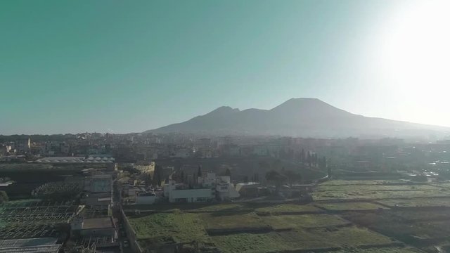 Drone view - Vesuvius to herculaneum tracking forward - backlight