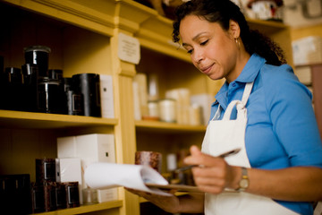 Sales clerk taking inventory in store