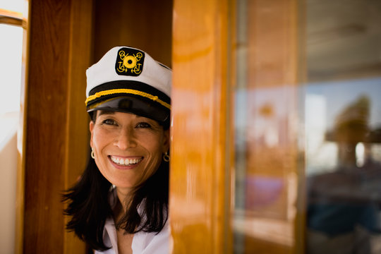 Mature woman wearing a sailor's hat and smiling