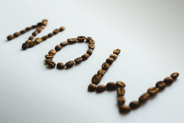 word made of coffee beans isolated on white