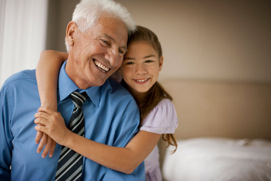 Smiling grandfather with his daughter