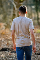 Teenage boy outside on a bright Spring day