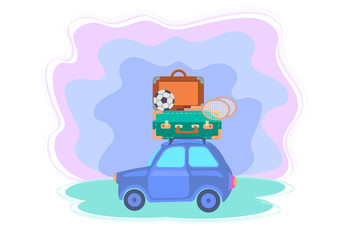Fototapeta premium Car with suitcases, soccer ball and badminton rackets on the roof.