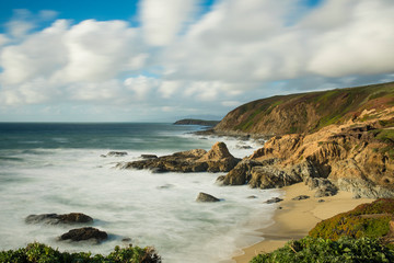 Fototapeta na wymiar Extemely long exposure of waves crashing on the California coast at Bodega Bay near San Francisco.