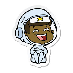 Fototapeta premium sticker of a cartoon laughing astronaut