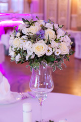 Banquet decorated table, with cutlery. Wedding decor in the banquet hall. Serving of a festive table, plate, napkin, knife, fork. Table setting decoration. Romantic Dinner or other events - wedding.