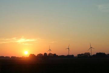 beautiful sunset and wind turbine