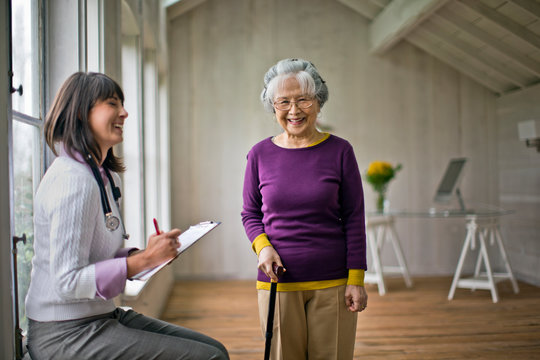 Elderly woman at a medical check-up with her doctor.