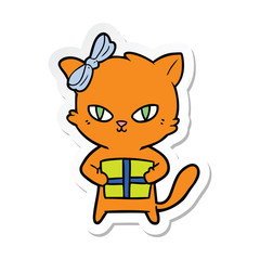 sticker of a cute cartoon cat with present