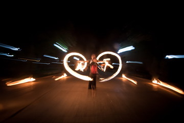 Amazing fire show dance. Fire dancers playing with flame