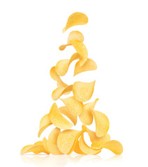 Potato chips fall on a pile, isolated on a white background