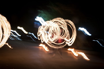 Amazing fire show dance. Fire dancer playing with flame