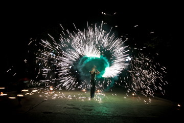 Amazing fire show dance. Fire dancers playing with flame